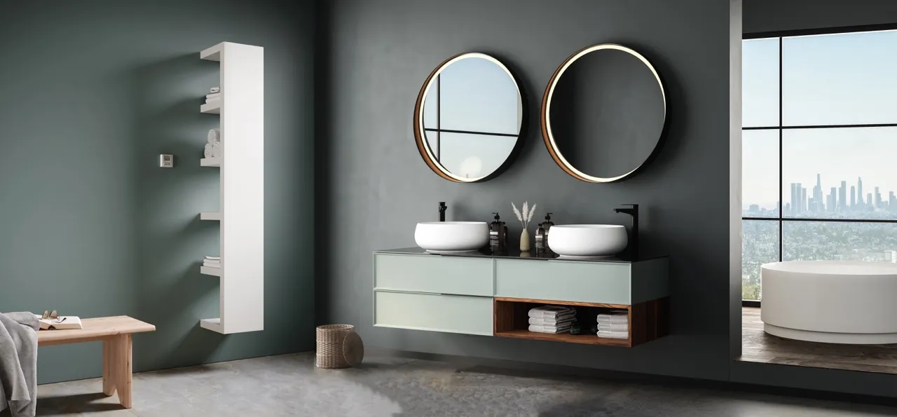 Badezimmer mit Waschtisch, runden Spiegeln und Design-Heizkörper Quadraqua der Marke Bemm.